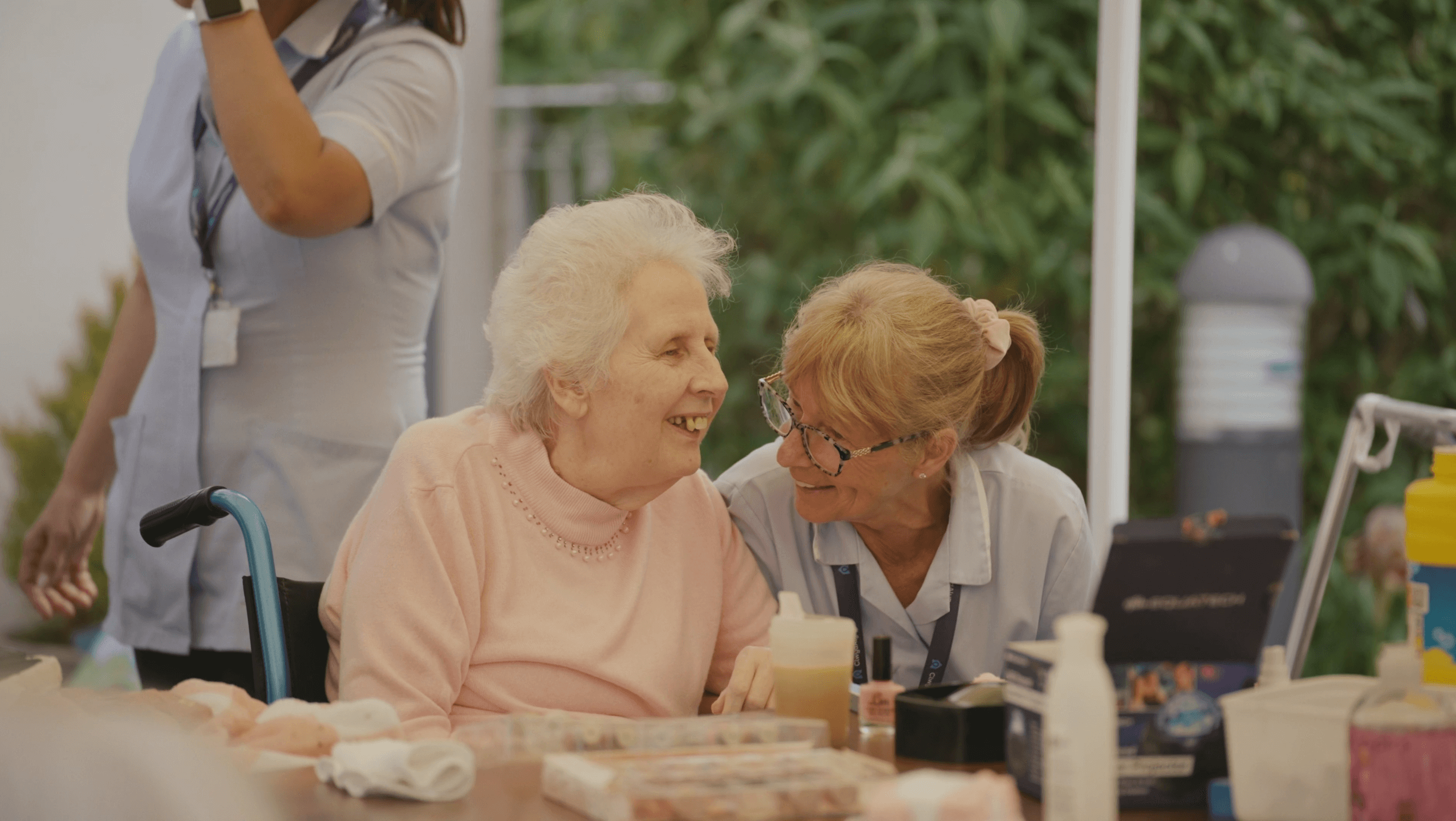 staff member painting residents nails at Merton Place